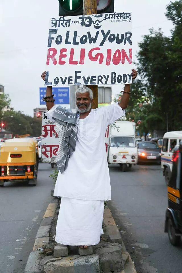 This is Krishnadas, a man who stands everyday for hours on end at Juhu Circle in Mumbai with a sign that says;â€˜Apne dharm par chalo, sabse prem karo(Follow your religion, love everybody)â€™.